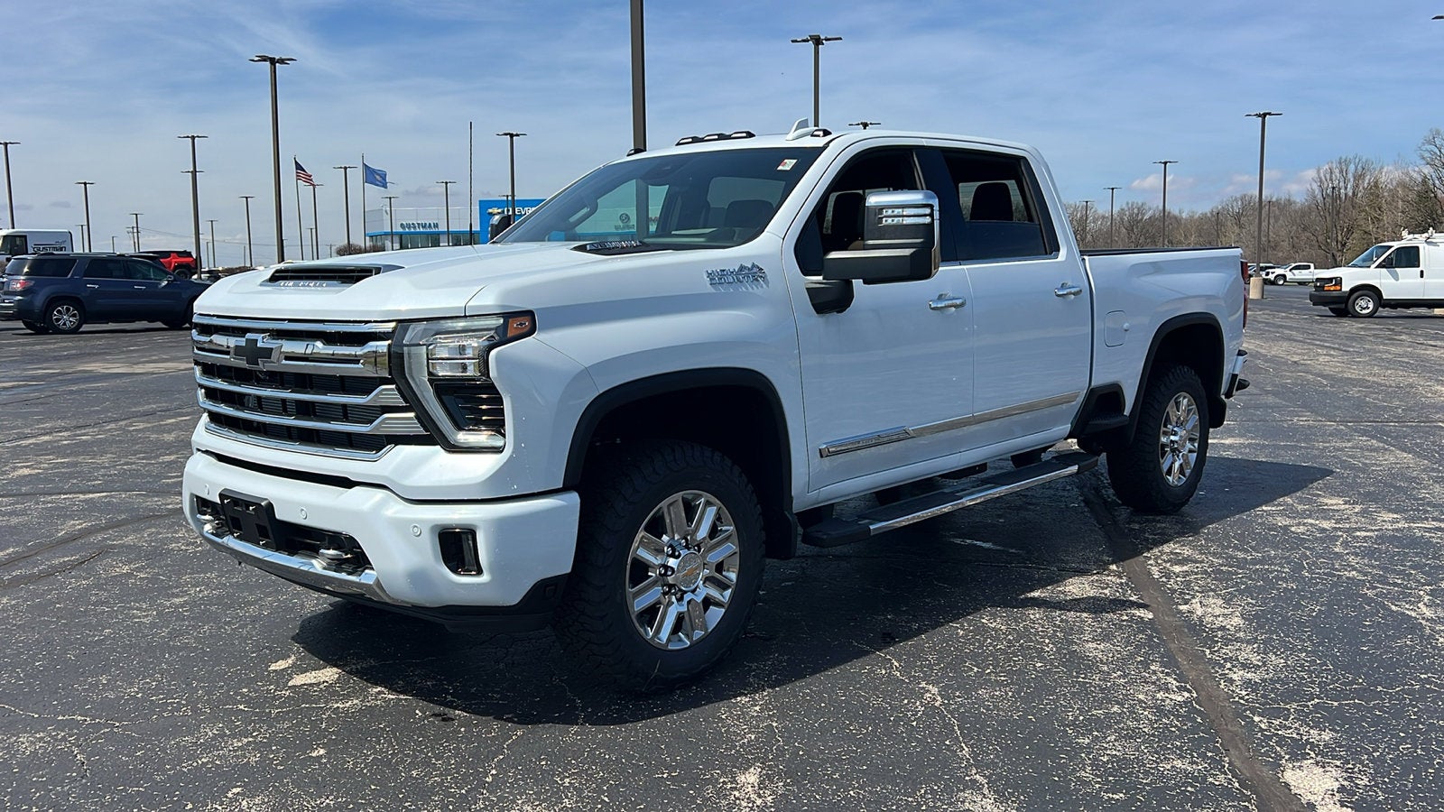 2026 Chevrolet Silverado 2500 HD High Country in Polar White Tricoat — front three-quarter view